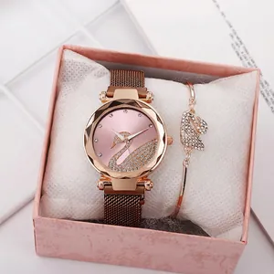 Detail of rose gold swan watch set with pink dial and matching crystal bracelet in gift box