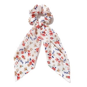 Floral print scrunchie with long ribbons in white chiffon and colorful blossoms