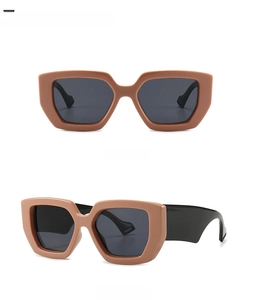 Front and 45-degree side views of retro brown hexagonal sunglasses with dark grey lenses