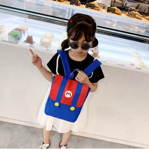 Close-up of Super Mario themed kids backpack featuring red-blue contrast and M logo