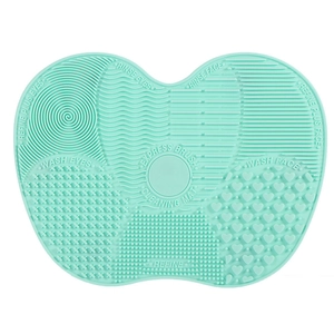 Mint green silicone makeup brush cleaning mat with varied textures for deep washing