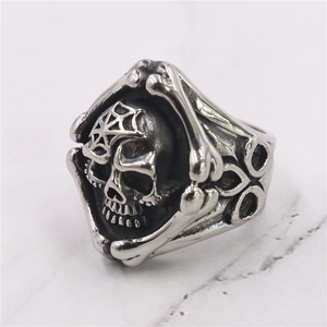 Macro shot of punk style skull ring with spider web engraving and aged silver finish