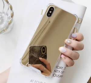 Close-up of golden mirror finish phone case with anti-fall protection and precise camera cutouts
