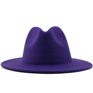 Macro detail of high-quality dark purple wool felt fedora hat with wide brim design