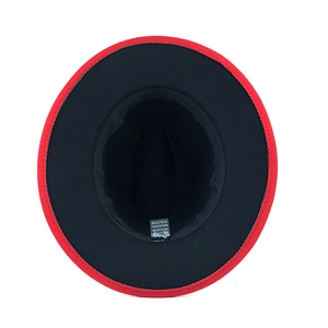 Detail of red and black fedora hat showing 65% cotton and 35% polyester washing label