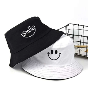 Detail of kids bucket hats with smiley embroidery and high-quality cotton fabric