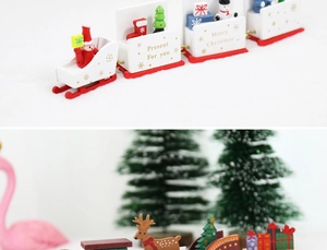 Detail of wooden Christmas train decor with Santa, snowman and festive gift box elements