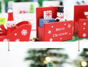 Close-up of wooden Christmas train with Santa and snowman on a festive background