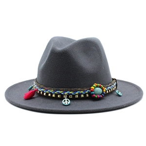 Detail of wool fedora with bohemian woven band, turquoise stone, and peace charm