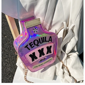 Detailed view of a pink holographic tequila bottle crossbody bag with a metal gold chain
