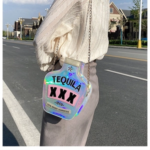 Close-up of holographic wine bottle crossbody bag with creative Tequila embroidery