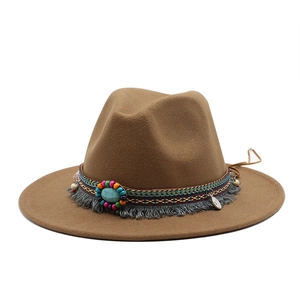 Detail of wool fedora hat featuring bohemian beads, turquoise stone and ethnic tassels