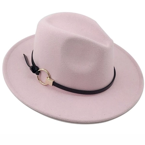 Close-up of pink wool jazz fedora hat featuring black leather band and gold metal ring