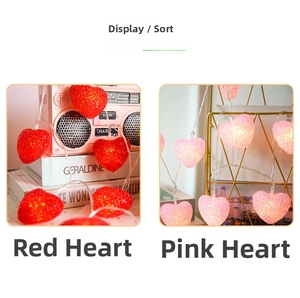 Detail of pink and red heart LED string lights showing frosted texture and soft glow