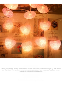 Detail of pink crystal heart LED string lights with textured finish and warm ambient glow