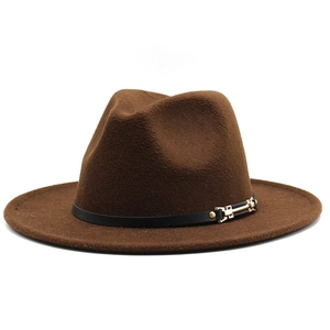 Close-up of deep brown fedora hat with elegant black strap and gold metal buckle detail