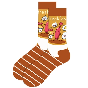 Detail of knit crew socks with orange stripes and cartoon breakfast patterns