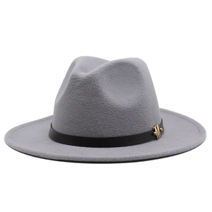 Detail of grey wool fedora hat featuring black leather band and golden M metal accessory