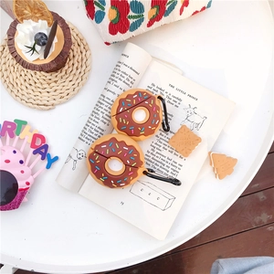 Detailed view of donut-shaped silicone AirPods cases with colorful sprinkles and clips