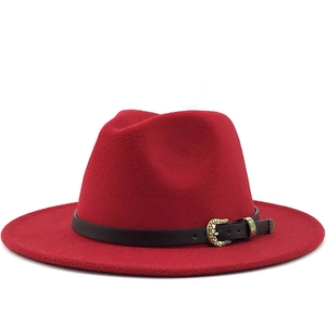 Red wool fedora hat with a black leather band and gold leaf buckle on white background