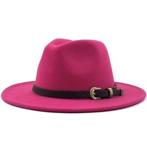 Detailed shot of magenta wool fedora hat with black leather band and gold metal buckle