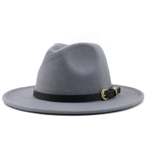 Detailed shot of grey fedora wool hat with black leather band and gold leaf buckle