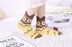 Detail view of cotton owl socks with 3D ears and contrast yellow stitching