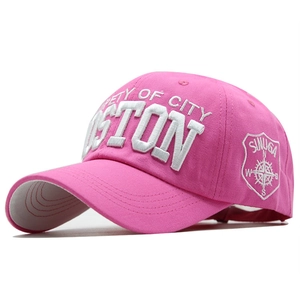 Detail of pink cotton baseball cap with 3D white Boston embroidery and side shield logo