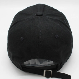 Detailed back view of a black cotton baseball cap showing adjustable metal buckle strap
