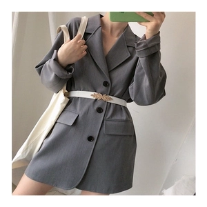 Gray blazer dress paired with a white waist belt featuring a gold leaf shaped buckle
