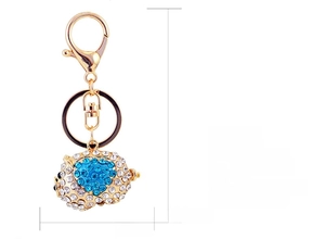 Detail view of crystal pig keychain showing 10.3cm total length and 3.8x5.5cm size details