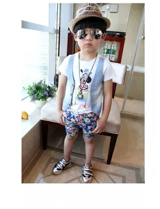 Detailed set of kids' summer outfit with zebra tee, denim vest, and floral shorts