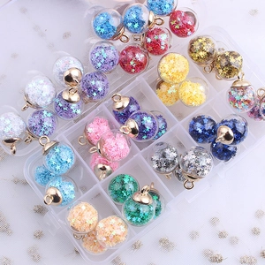 Detailed view of colorful star sequin glass ball pendants for DIY jewelry making