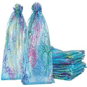 Detail of blue organza drawstring bags with gold coral patterns and smooth texture