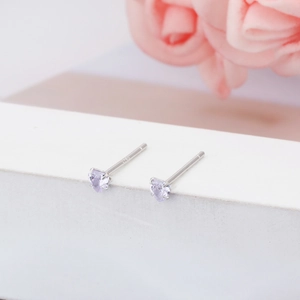 Detail view of 3mm lavender heart S925 sterling silver minimalist stud earrings.