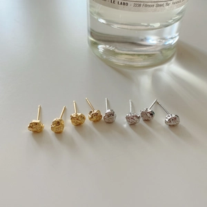 Detail showing irregular molten lava texture on 925 sterling silver stud earrings