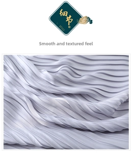 Close-up of pleated silk-like scarf fabric in light lavender with organza texture