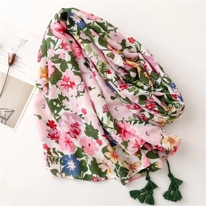 Floral cotton linen scarf with bright botanical print and dark green tassels