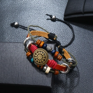 Detailed close-up of retro leather bracelet with sunflower charm and wooden beads