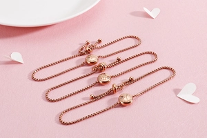 Detailed view of rose gold zodiac bracelets with adjustable slider and sparkling zircon