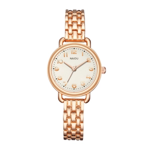 Close-up of elegant rose gold bracelet watch with white dial and Arabic numerals