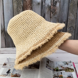 Foldable handmade crochet straw sun hats with fringe edges in cream and light brown