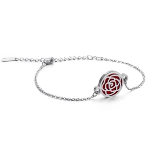 Polished silver stainless steel bracelet with a hollow red rose charm shown from a side angle