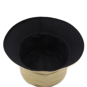 Double-sided leather bucket hat with metallic gold finish and black fabric lining