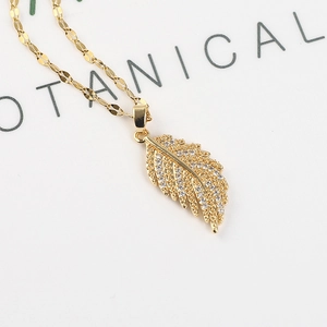 18K gold plated feather necklace pendant with cubic zirconia stones on thin chain