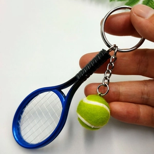 Mini tennis racket and ball keychain set with blue metallic frame and green fuzzy ball