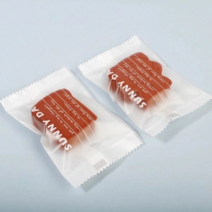 Detail of bear-shaped makeup sponge in hygienic sealed individual frosted packaging