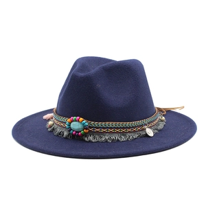 Detail of bohemian navy wide brim fedora with beaded band and turquoise stone decor