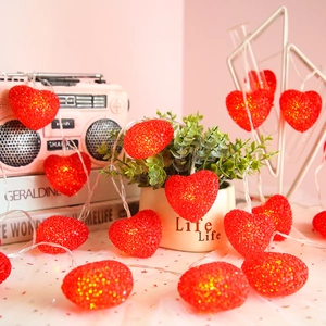 Romantic red heart LED string lights with warm glow for wedding and party decor