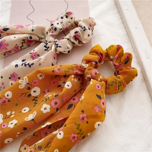Floral chiffon scrunchies with long ribbons in cream and ginger yellow colors